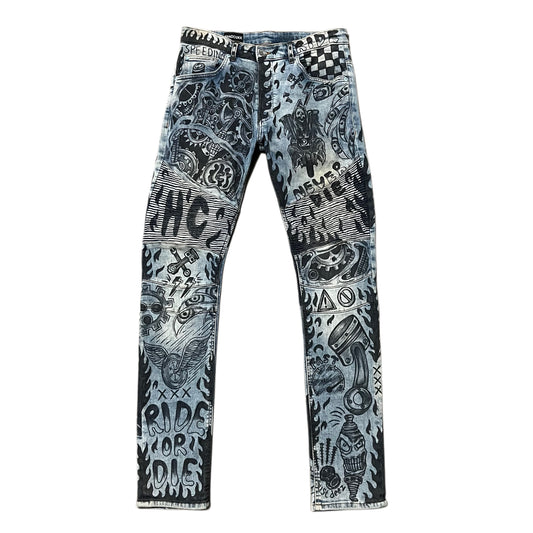 Blue jeans with black graphic designs on a white background