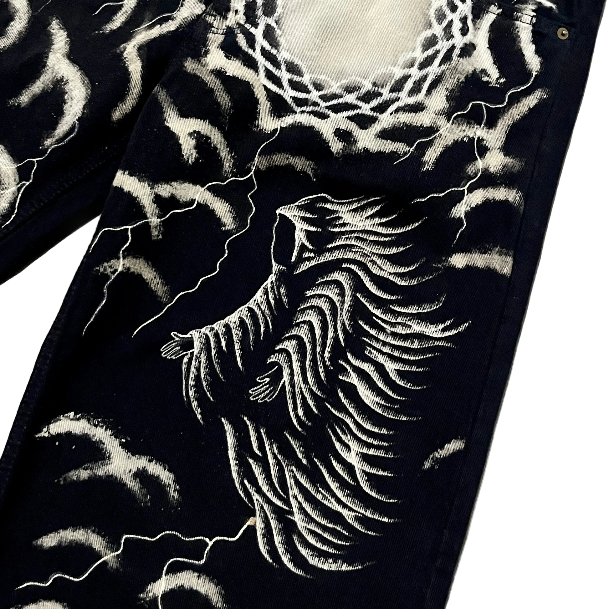 Black denim pants featuring a highly detailed white graphic hand painted bleach of a winged figure, lightning bolts, and web-like patterns.