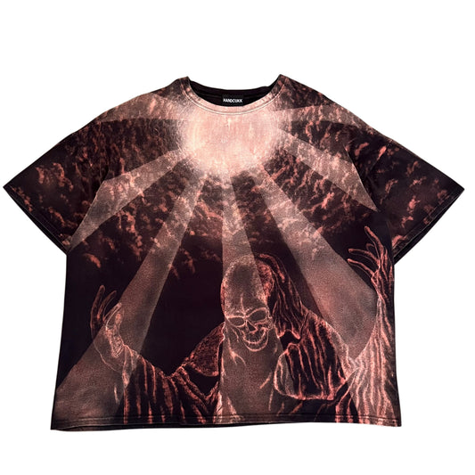 A short-sleeve t-shirt featuring a dark, horror-themed graphic print of a skeletal figure with glowing hands and rays of light radiating from the chest. The shirt has a black collar label with the brand name 'HANDCUKK' visible.