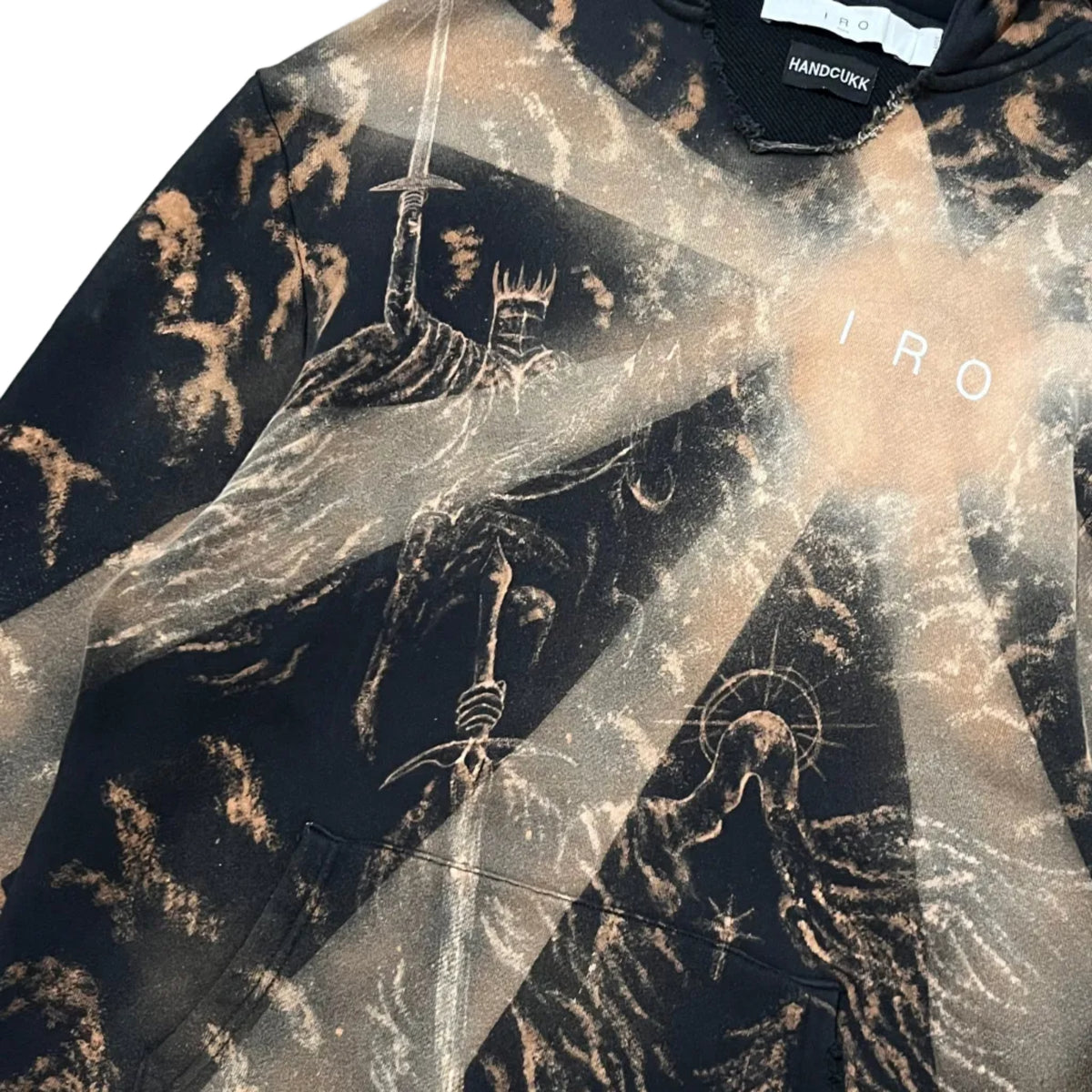 A black IRO Paris hoodie distressed sweatshirt featuring a grim reaper graphic holding a sword, with the word 'IRO' printed on the chest and a visible HANDCUKK brand label inside the collar.