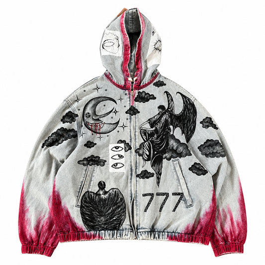 A custom hand painted design hooded zip-up denim jeans jacket, vintage acid wash base with black occult-style illustrations including a crescent moon, clouds, a horned figure, an sky, and the number 777, plus red tie-dye or bleach-splatter effects near the hem and cuffs.